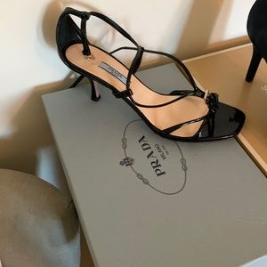This is a woman’s Prada shoe size 8 1/2 never worn black straps